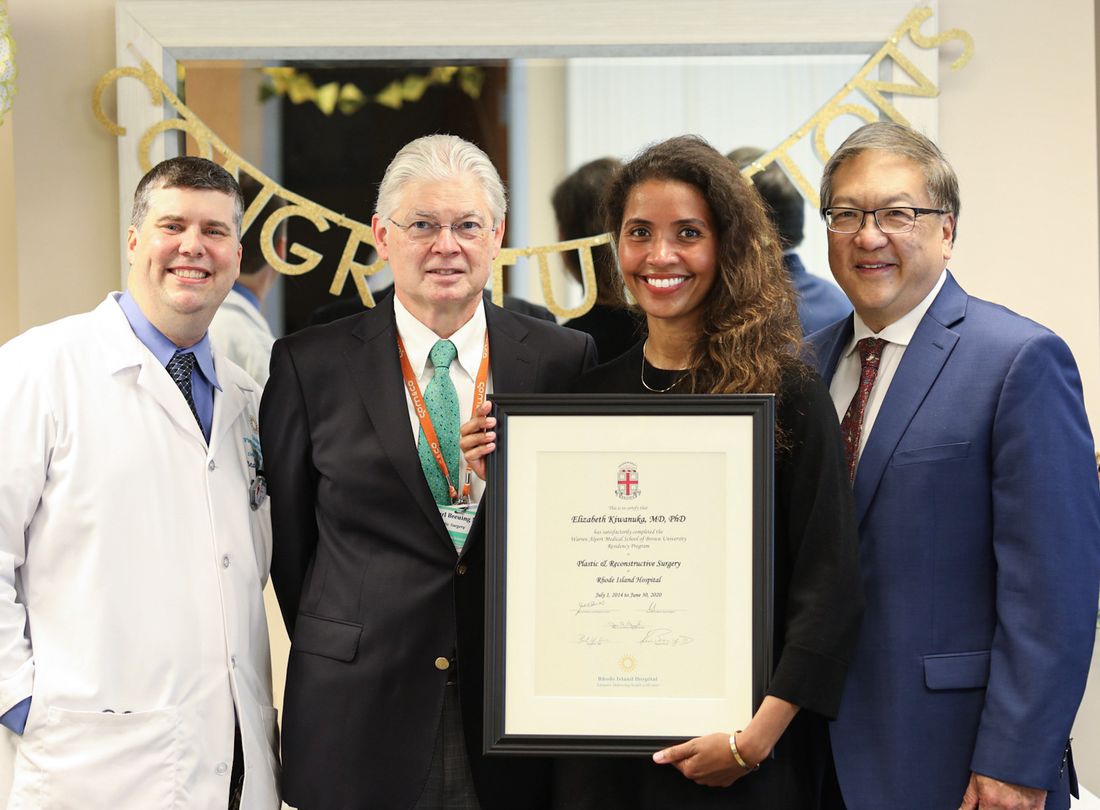 Dr. Kiwanuka receiving her Brown University plastic surgery certificate